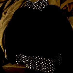 A black long sleeve shirt with polkadots